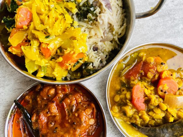 Thali meal with fluffy rice, tomato chutney and Rudy special, which is carrots, cabbage, cauliflower with grated coconut